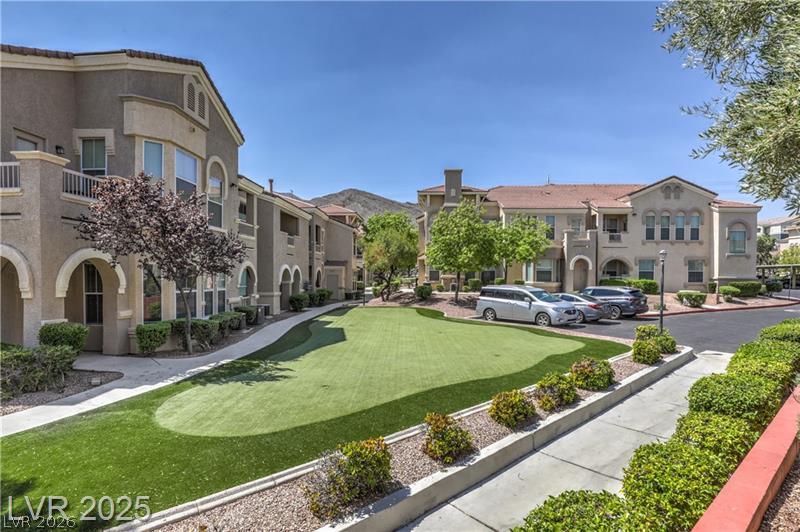 10550 West Alexander Road, Unit 2148 Las Vegas, NV 89129 - Photo 34 of 41 Manicured green spaces define this elegant community with traditional architecture.