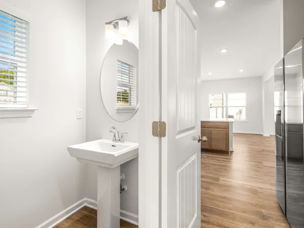 a bathroom with a sink a mirror and a shower