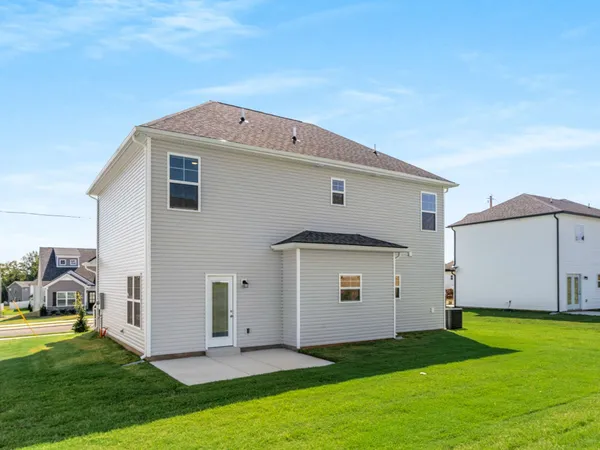 a view of a house with backyard