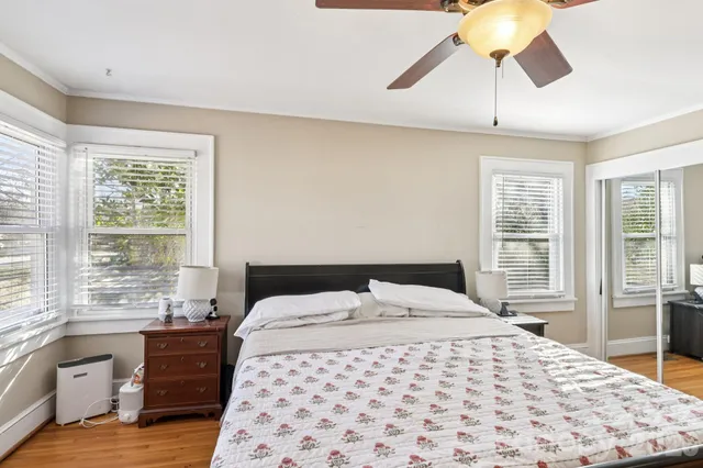 a bedroom with a large bed and a window