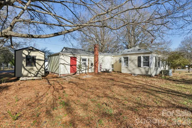 a view of a backyard of the house