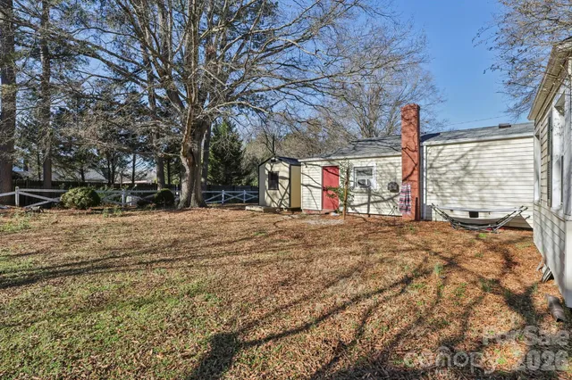a view of road with large trees