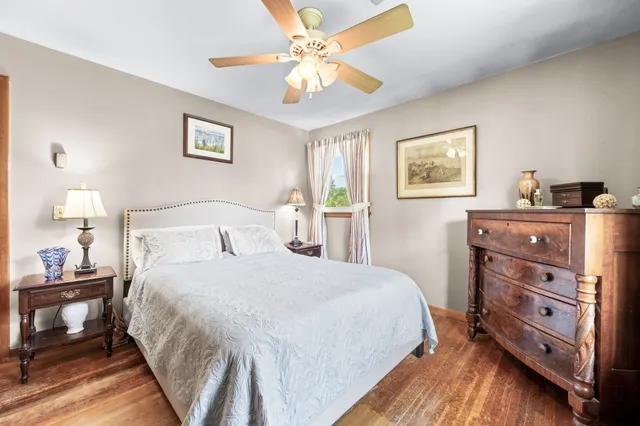 a bedroom with a bed and a dresser