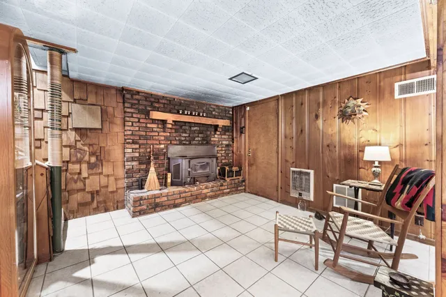 a view of a livingroom with furniture and a flat screen tv