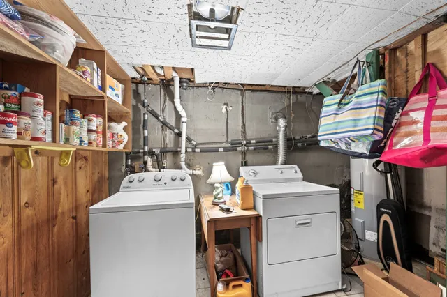 a balcony with wooden floor table and chairs