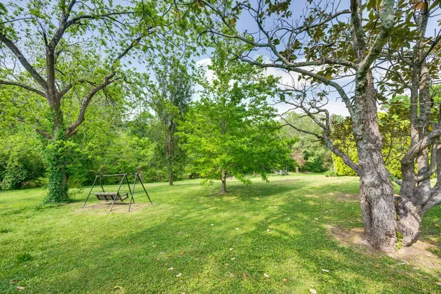 a view of a chairs and table in the patio