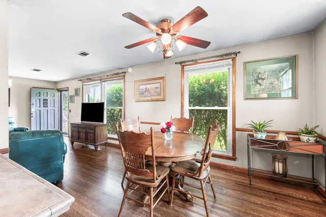 a view of a dining room with furniture window and wooden floor