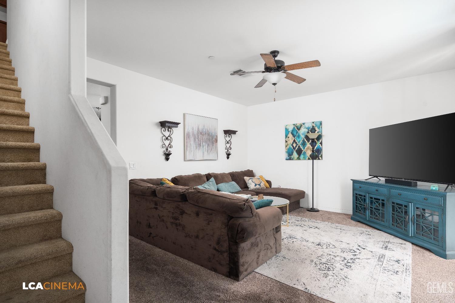Undisclosed Address Bakersfield, CA 93304 - Photo 11 of 19 a living room with furniture and a flat screen tv