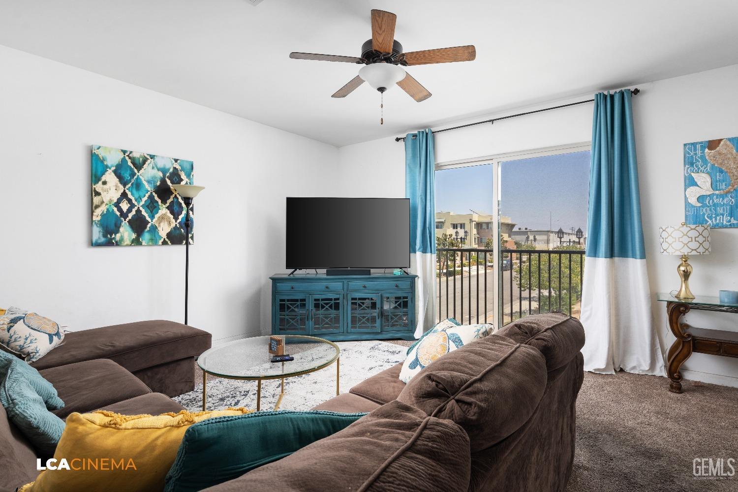 Undisclosed Address Bakersfield, CA 93304 - Photo 17 of 19 a living room with furniture and a flat screen tv
