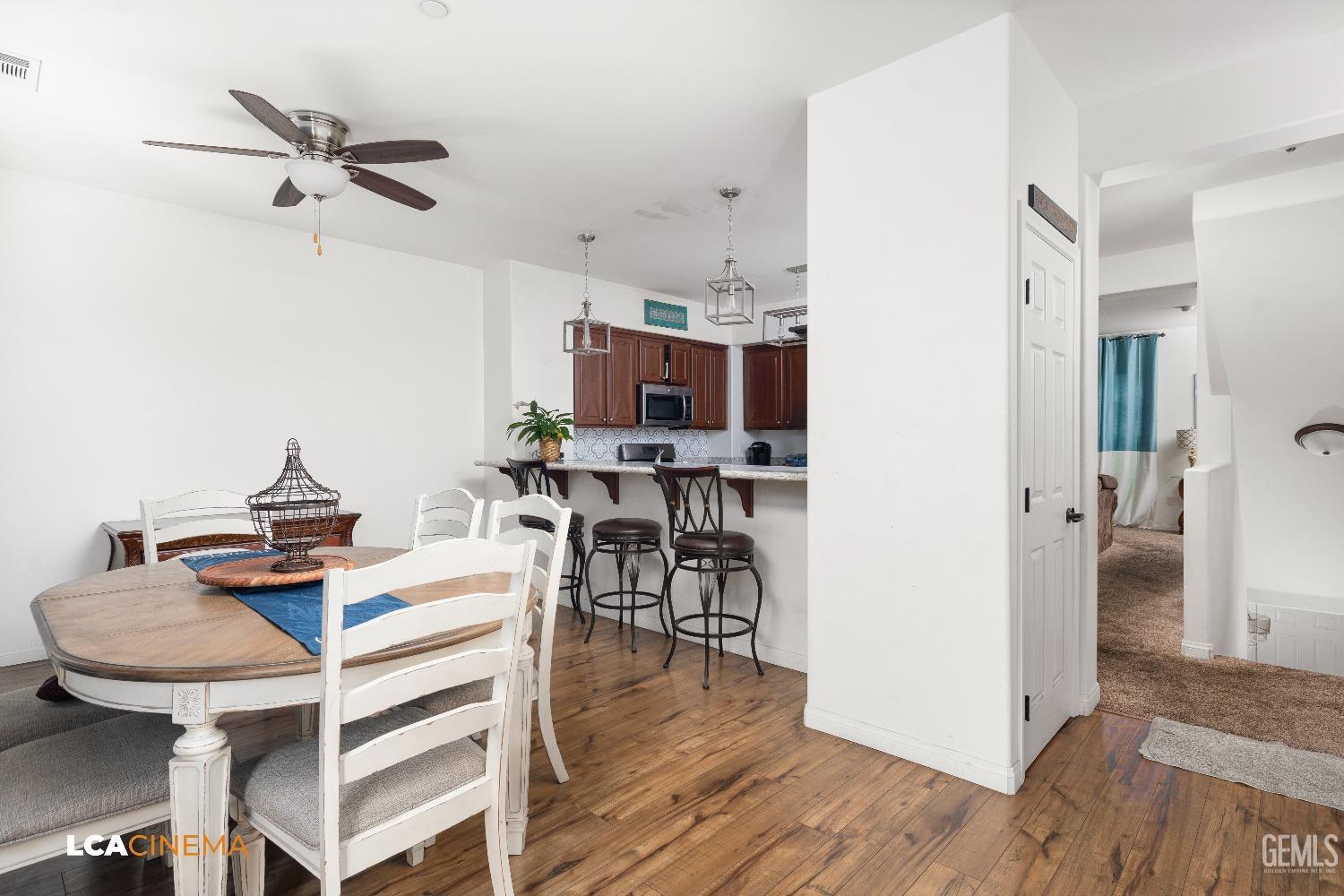 Undisclosed Address Bakersfield, CA 93304 - Photo 6 of 19 a view of a dining room with furniture and wooden floor