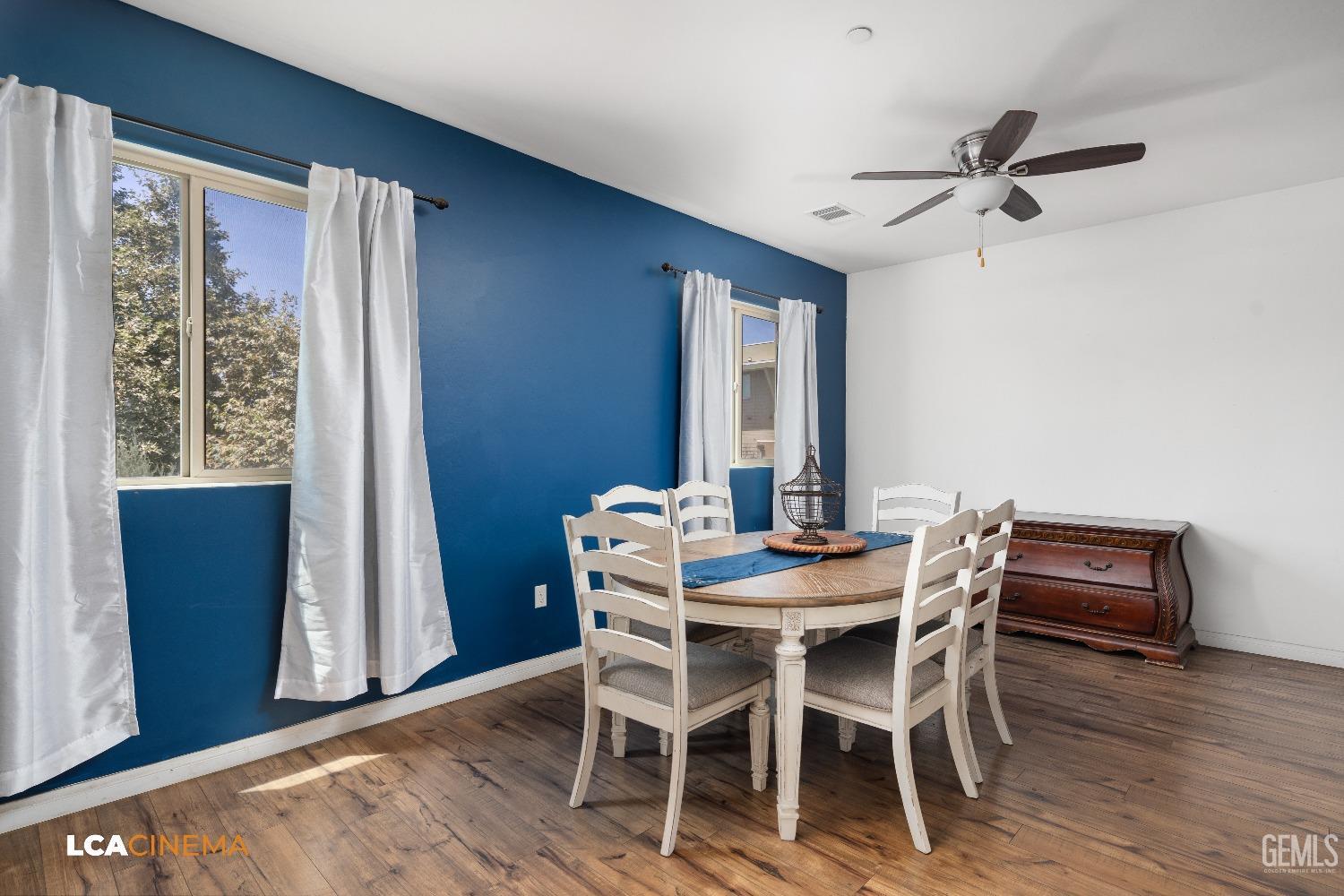 Undisclosed Address Bakersfield, CA 93304 - Photo 7 of 19 a view of a dining room with furniture window and wooden floor