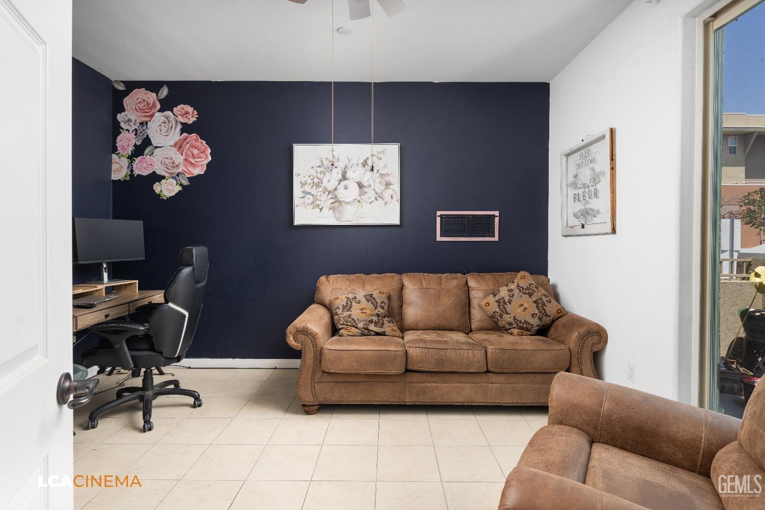 Undisclosed Address Bakersfield, CA 93304 - Photo 9 of 19 a living room with furniture and wall paintings