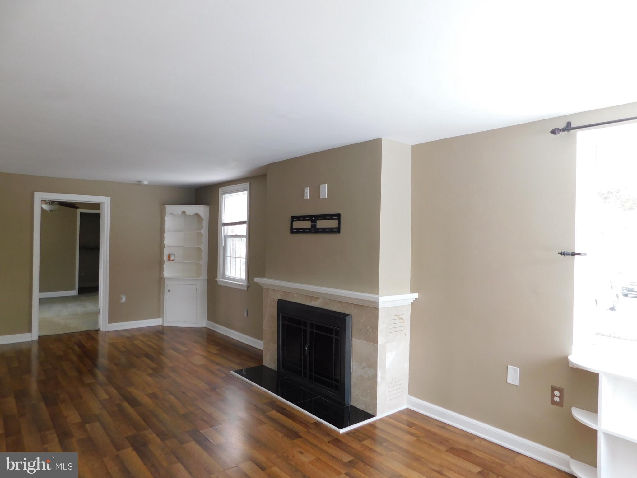 737 Churchville Road Southampton, PA 18966 - Photo 2 of 10 a view of an empty room with wooden floor and a window