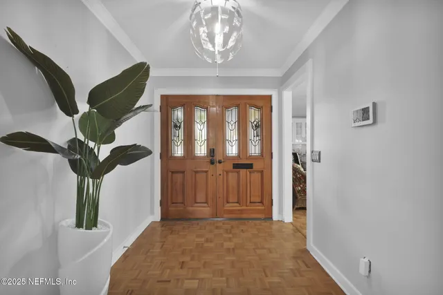 a view of a livingroom with furniture and a flat screen tv