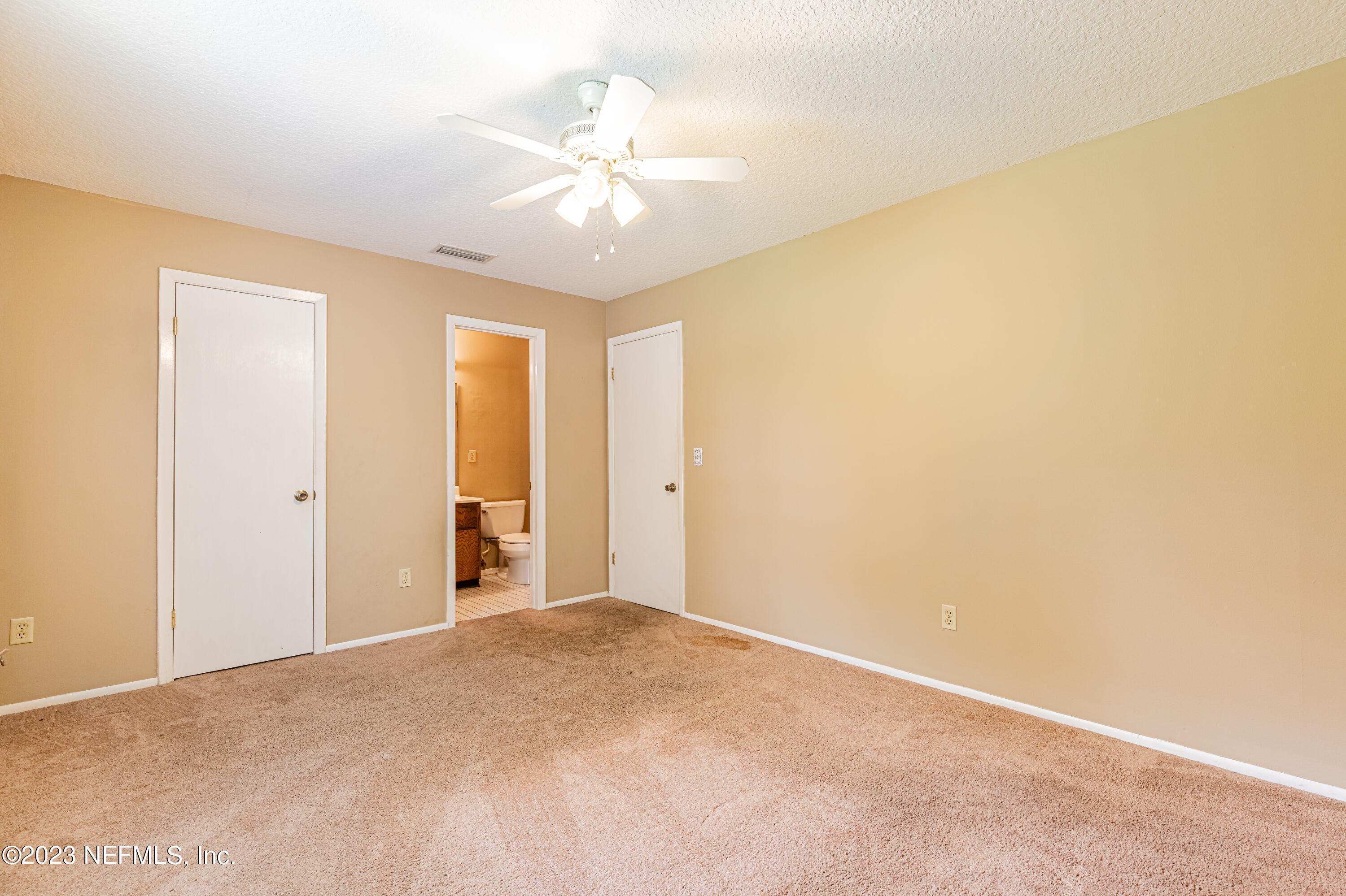 2833 Homestead Road Orange Park, FL 32065 - Photo 14 of 28 a view of an empty room with a chandelier fan