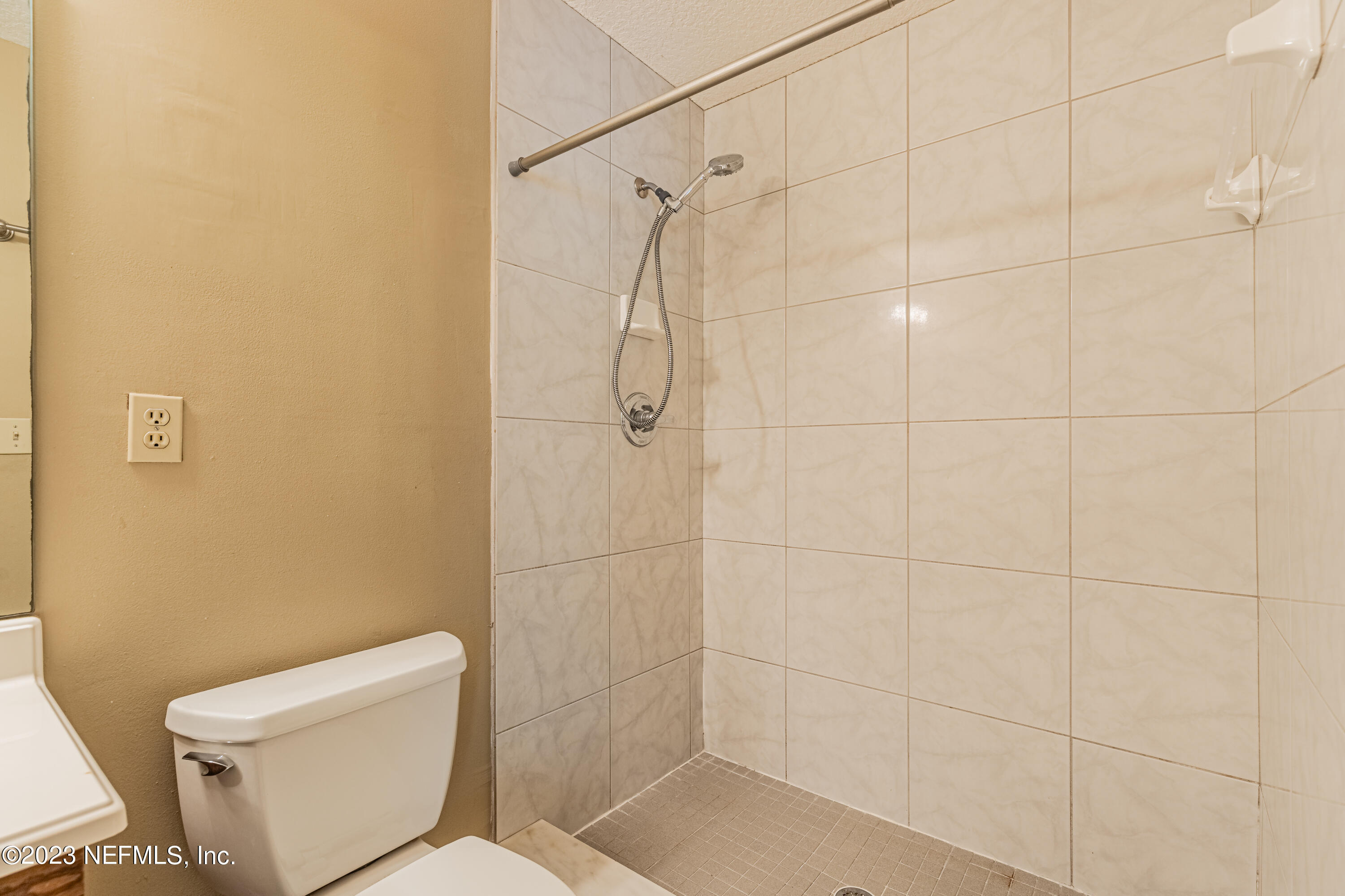 2833 Homestead Road Orange Park, FL 32065 - Photo 17 of 28 a bathroom with a toilet and shower