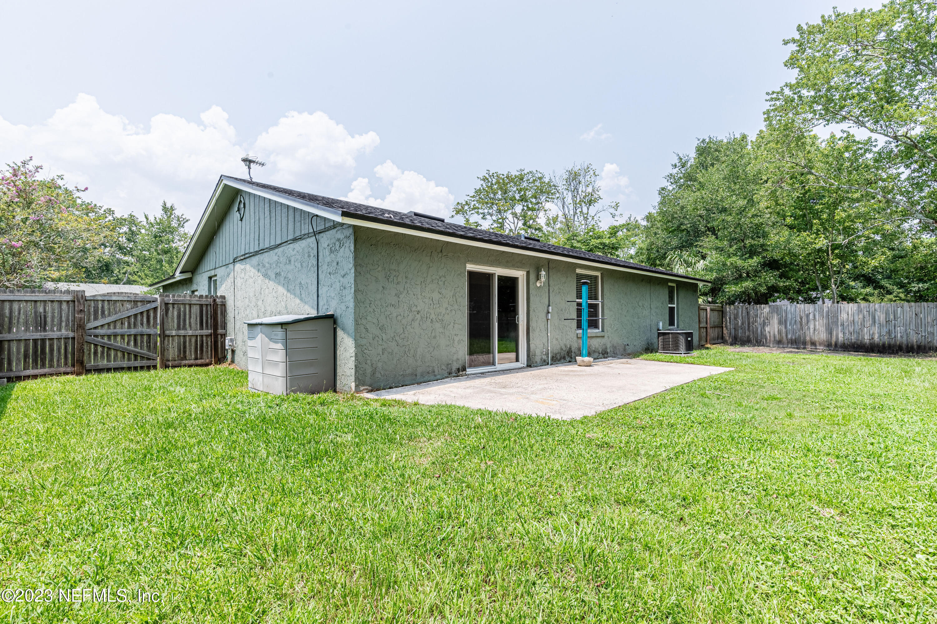 2833 Homestead Road Orange Park, FL 32065 - Photo 23 of 28 a front view of house with yard and trees