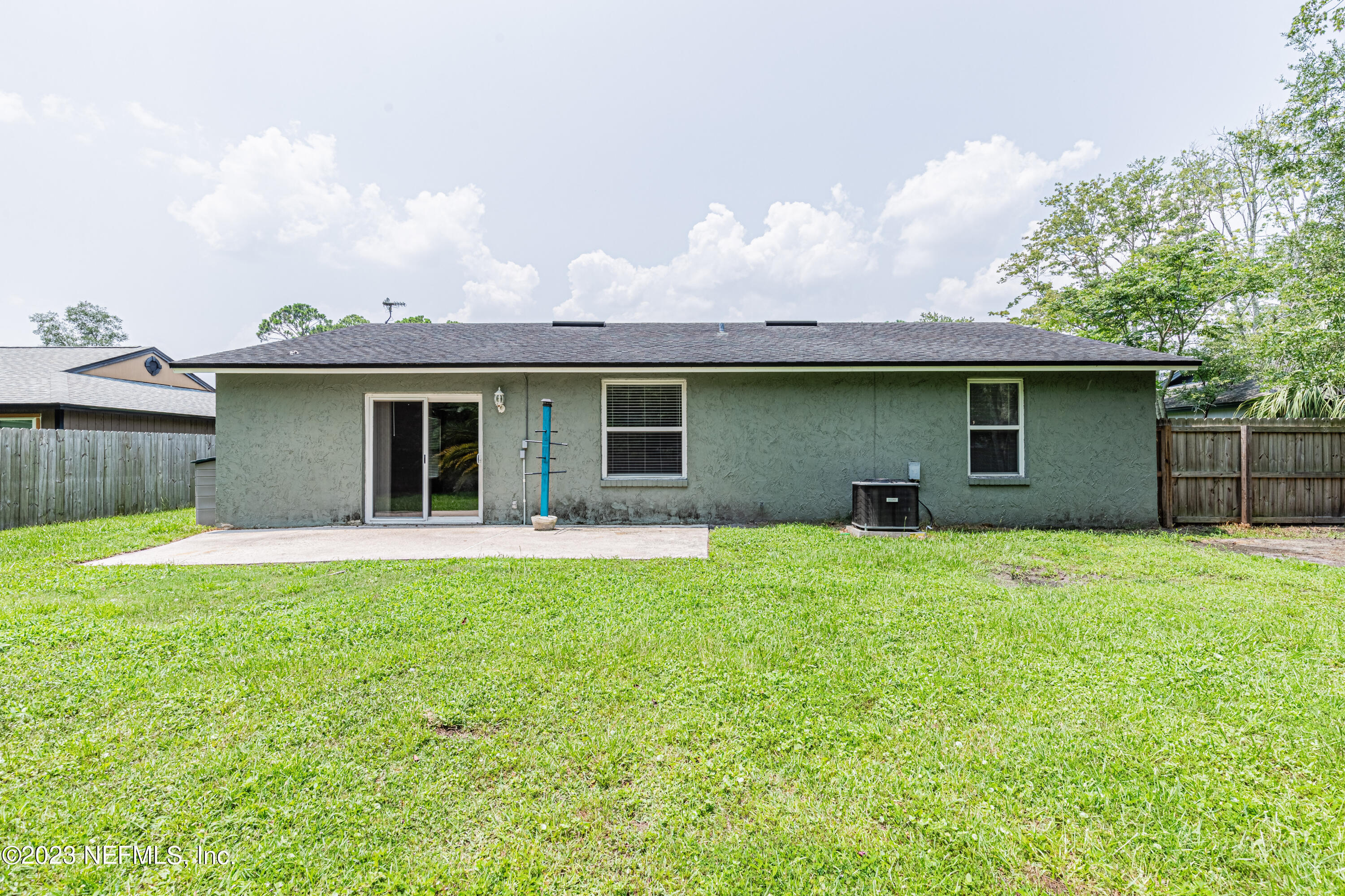2833 Homestead Road Orange Park, FL 32065 - Photo 24 of 28 a backyard of a house with table and chairs