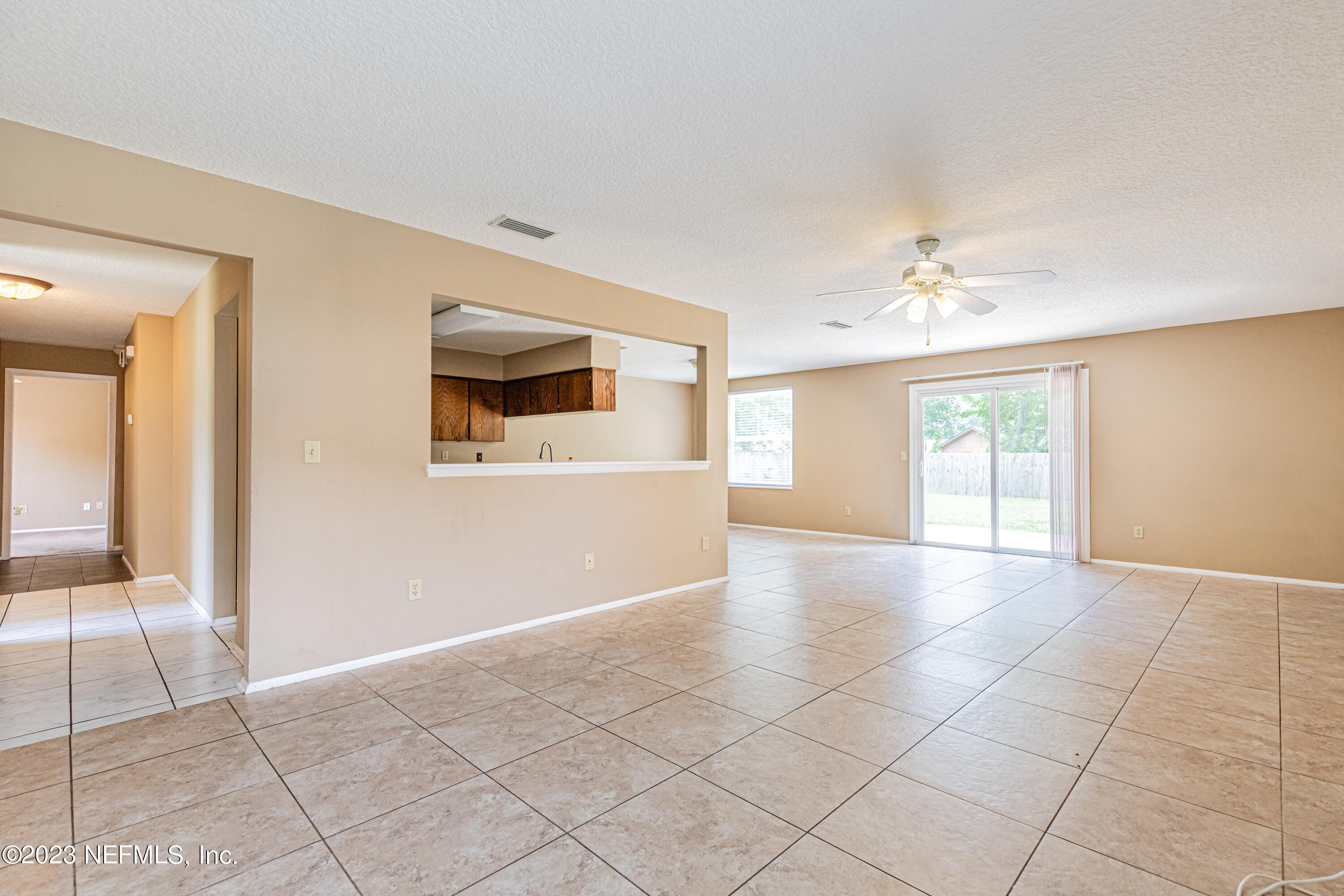 2833 Homestead Road Orange Park, FL 32065 - Photo 4 of 28 a view of an empty room with glass door