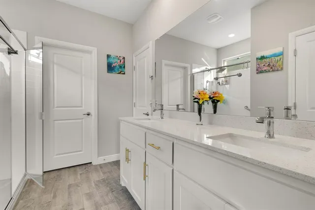 a bedroom with bed and windows