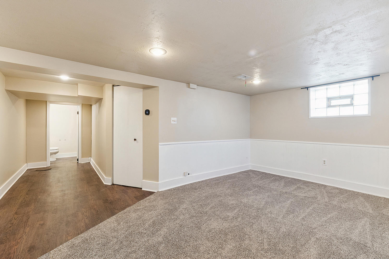 3316 Ann Street Lansing, IL 60438 - Photo 15 of 21 an empty room with wooden floor and windows