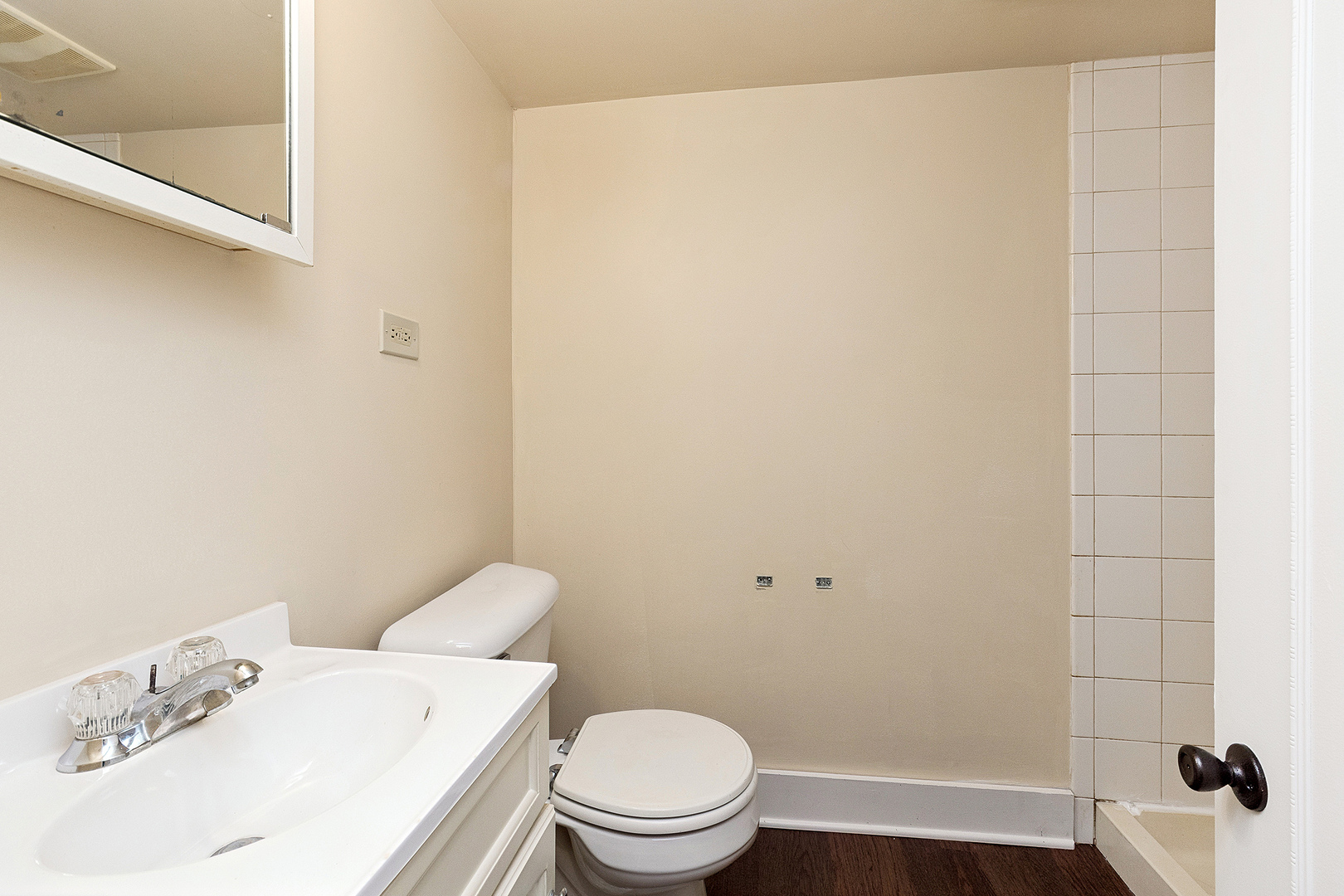 3316 Ann Street Lansing, IL 60438 - Photo 16 of 21 a white toilet sitting next to a bathroom sink