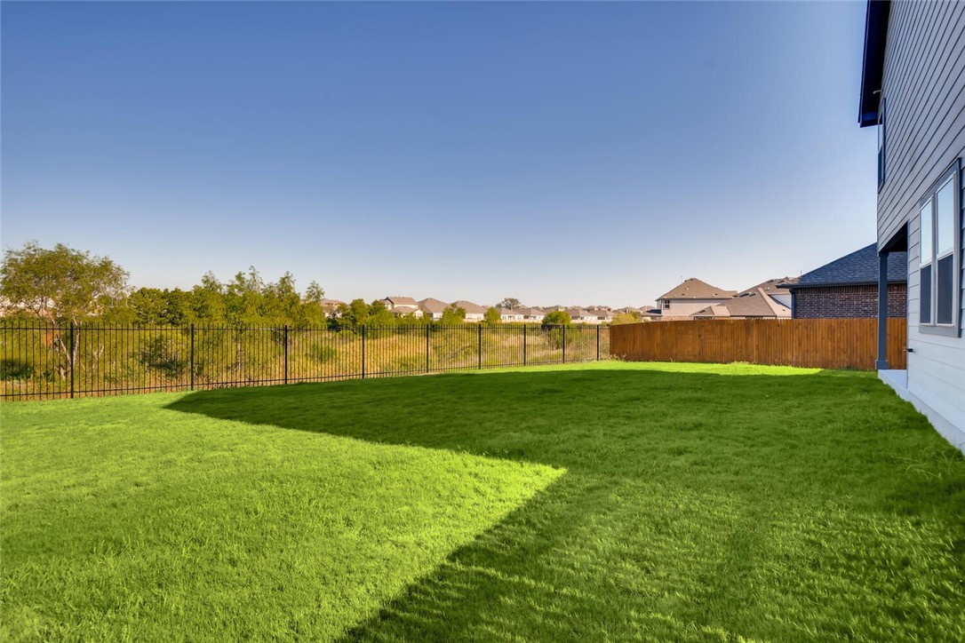 11608 Roxburgh Pass Austin, TX 78754 - Photo 12 of 12 a view of an ocean and a yard