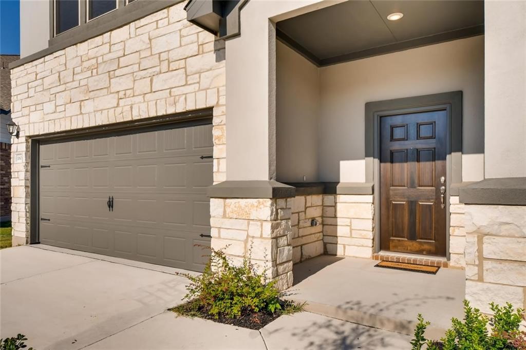 11608 Roxburgh Pass Austin, TX 78754 - Photo 2 of 12 a view of front door and potted plants