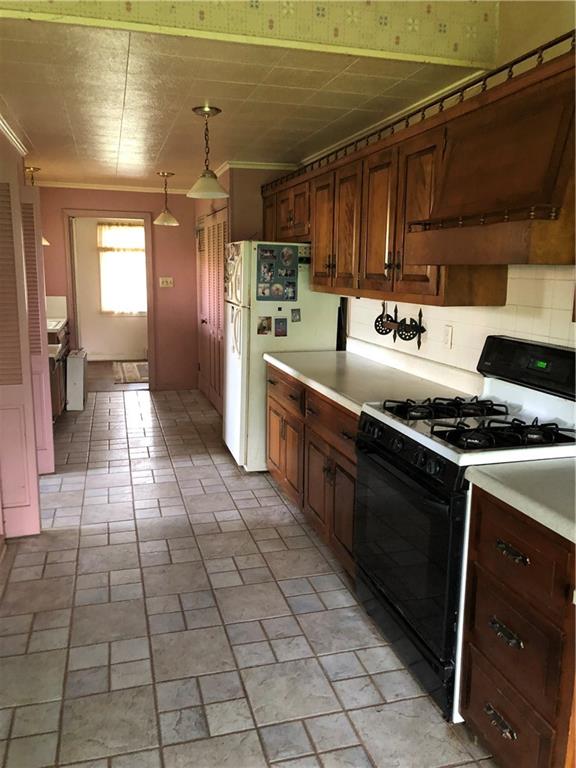 123 Grimm Road Sarver, PA 16055 - Photo 3 of 12 a kitchen with stainless steel appliances granite countertop a stove a sink and a microwave