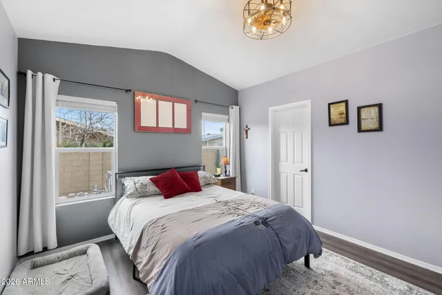 a bedroom with a large bed and a window