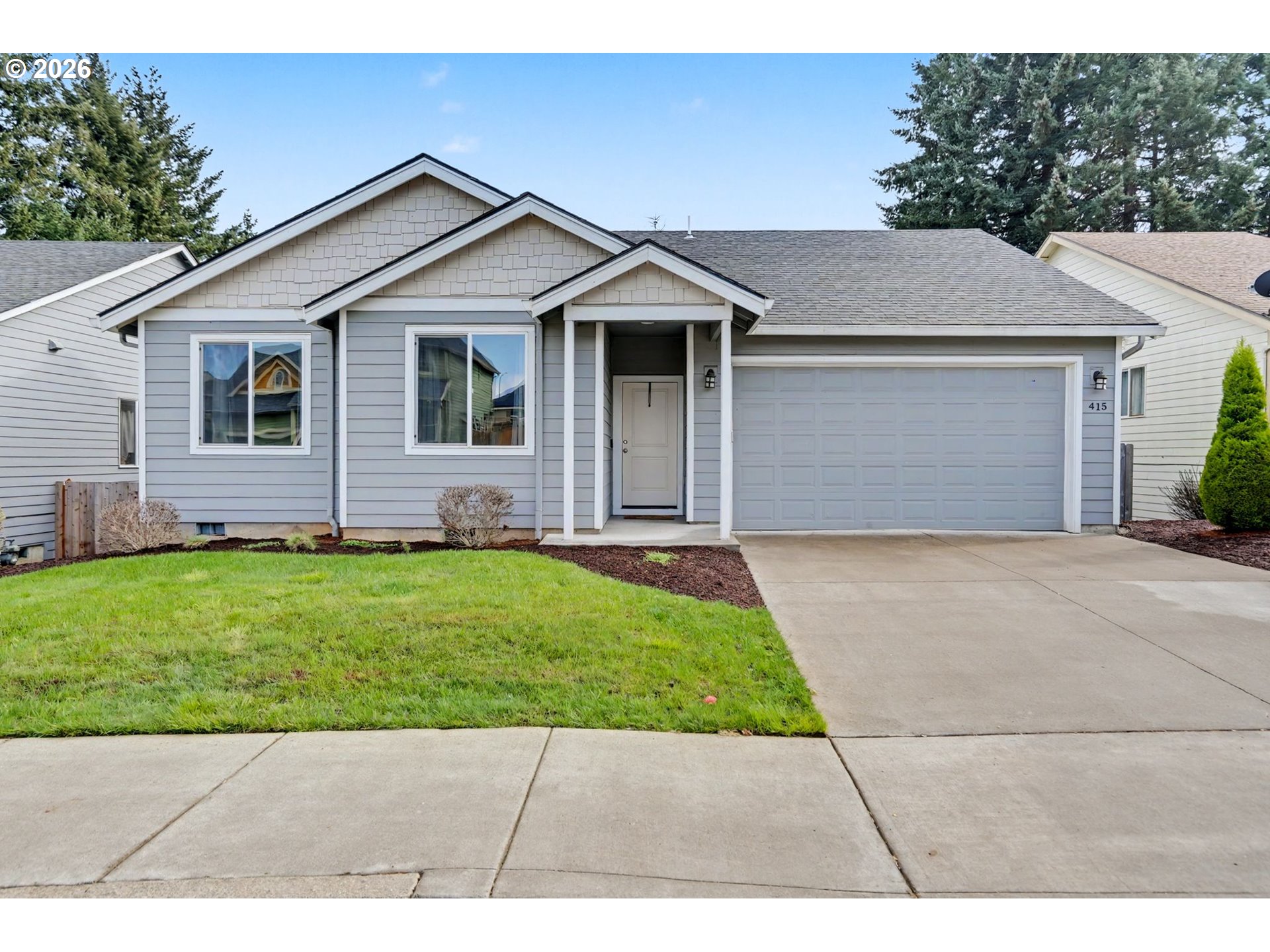 415 Northwest 6th Street Willamina, OR 97396 - Photo 1 of 34 a front view of house with yard