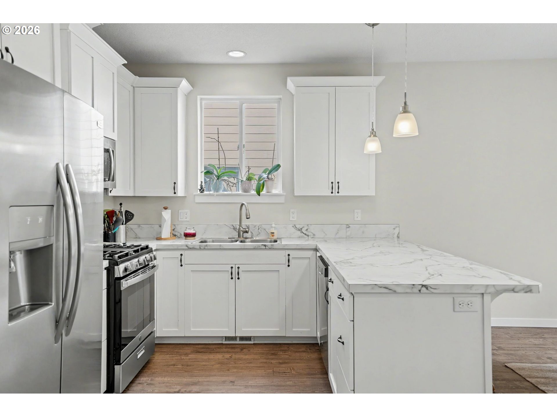 415 Northwest 6th Street Willamina, OR 97396 - Photo 13 of 34 a kitchen with a sink stove and refrigerator