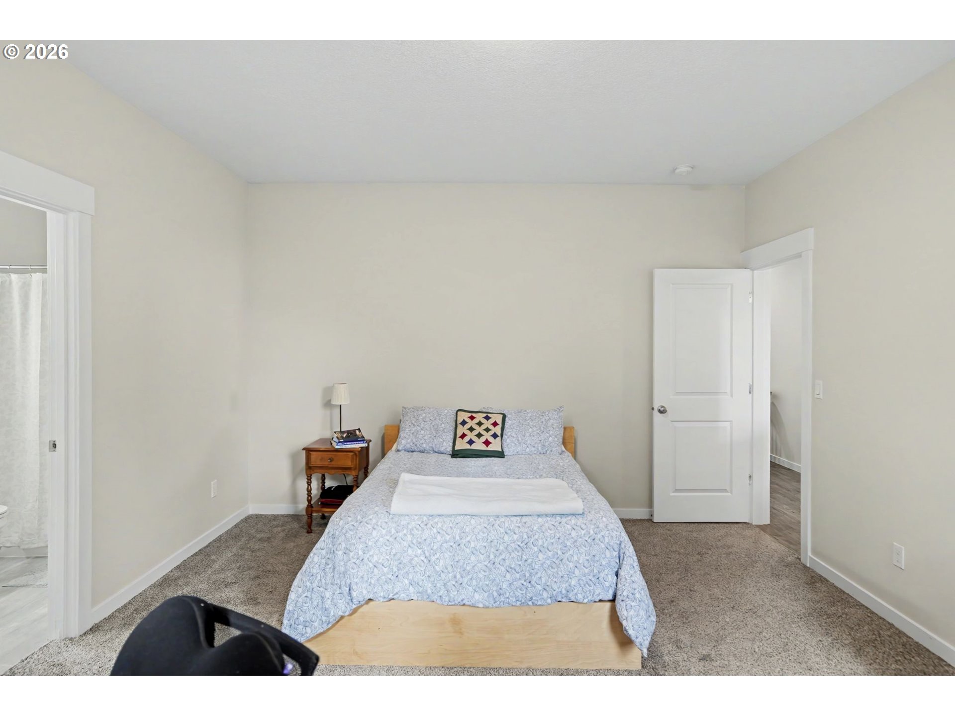 415 Northwest 6th Street Willamina, OR 97396 - Photo 17 of 34 a bedroom with a bed and a window