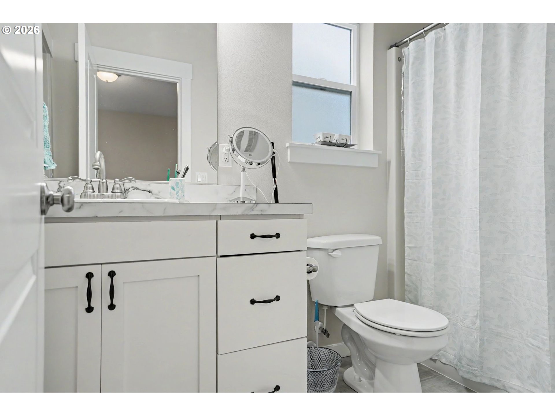 415 Northwest 6th Street Willamina, OR 97396 - Photo 19 of 34 a bathroom with a sink a toilet and mirror