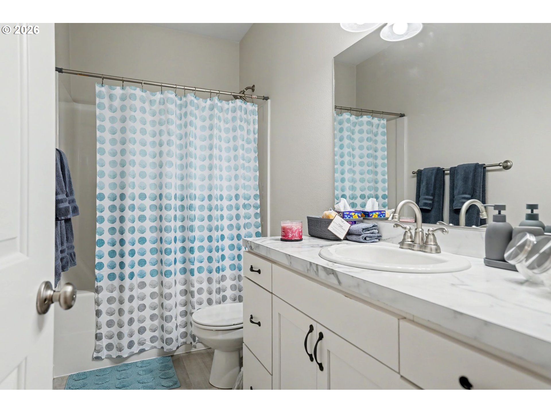 415 Northwest 6th Street Willamina, OR 97396 - Photo 20 of 34 a bathroom with a sink a toilet and shower curtain