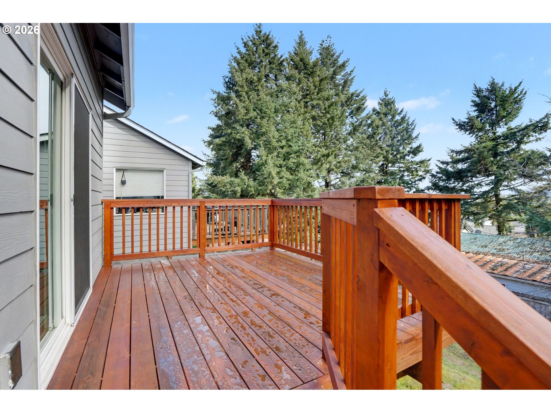 415 Northwest 6th Street Willamina, OR 97396 - Photo 30 of 34 a balcony with wooden floor and outdoor space