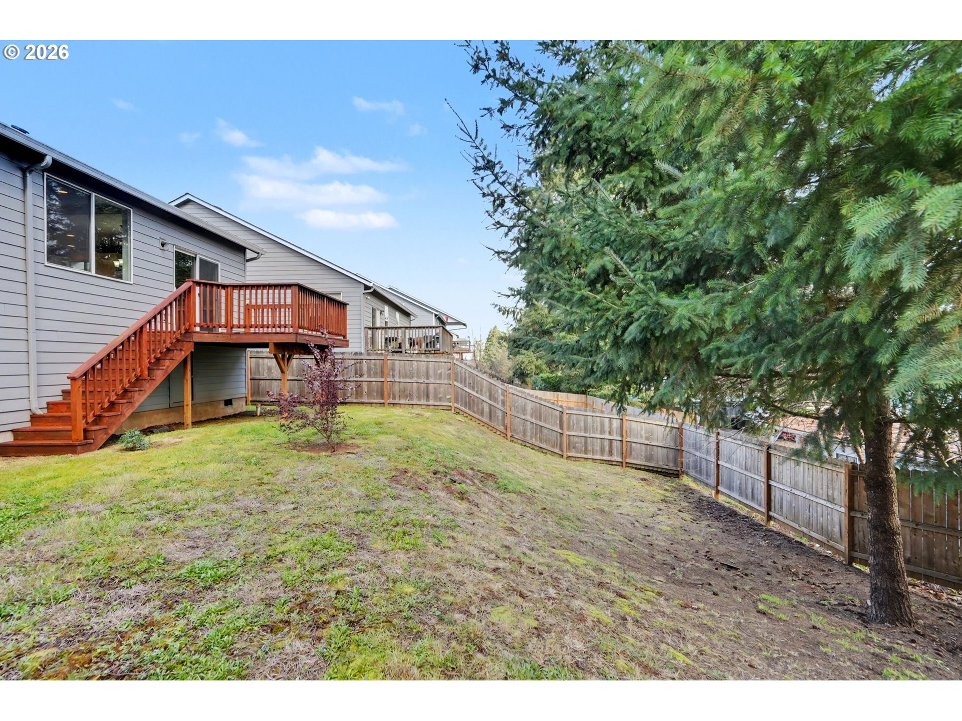 415 Northwest 6th Street Willamina, OR 97396 - Photo 33 of 34 a view of an house with backyard and a tree