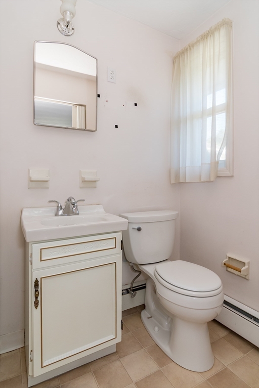 14 Rosslare Road, Unit 14 Framingham, MA 01701 - Photo 13 of 20 a bathroom with a sink toilet and mirror