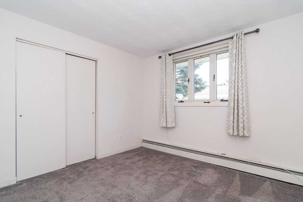 14 Rosslare Road, Unit 14 Framingham, MA 01701 - Photo 15 of 20 a view of empty room with window