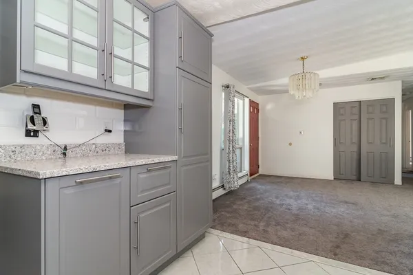 a kitchen with stainless steel appliances granite countertop a sink and cabinets