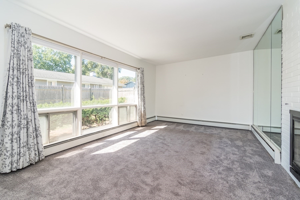 14 Rosslare Road, Unit 14 Framingham, MA 01701 - Photo 7 of 20 a view of an empty room with a window