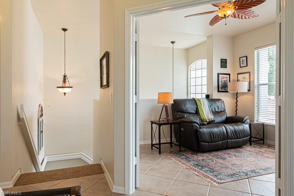 1965 Crestview Way, Unit 156 Naples, FL 34119 - Photo 2 of 45 a living room with furniture and a window
