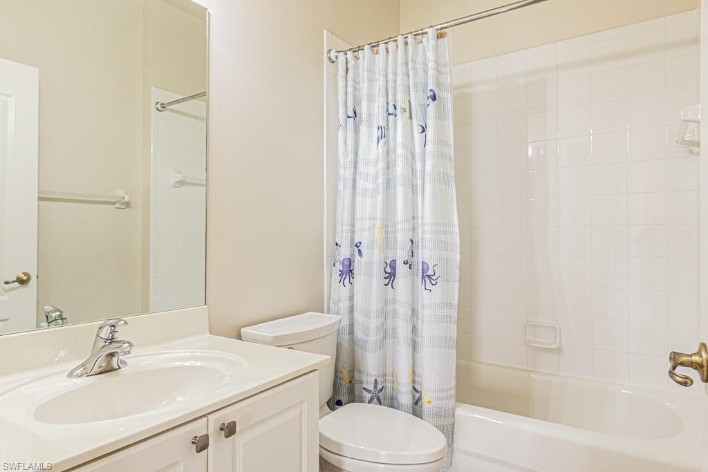 1965 Crestview Way, Unit 156 Naples, FL 34119 - Photo 22 of 45 a bathroom with a sink toilet and shower