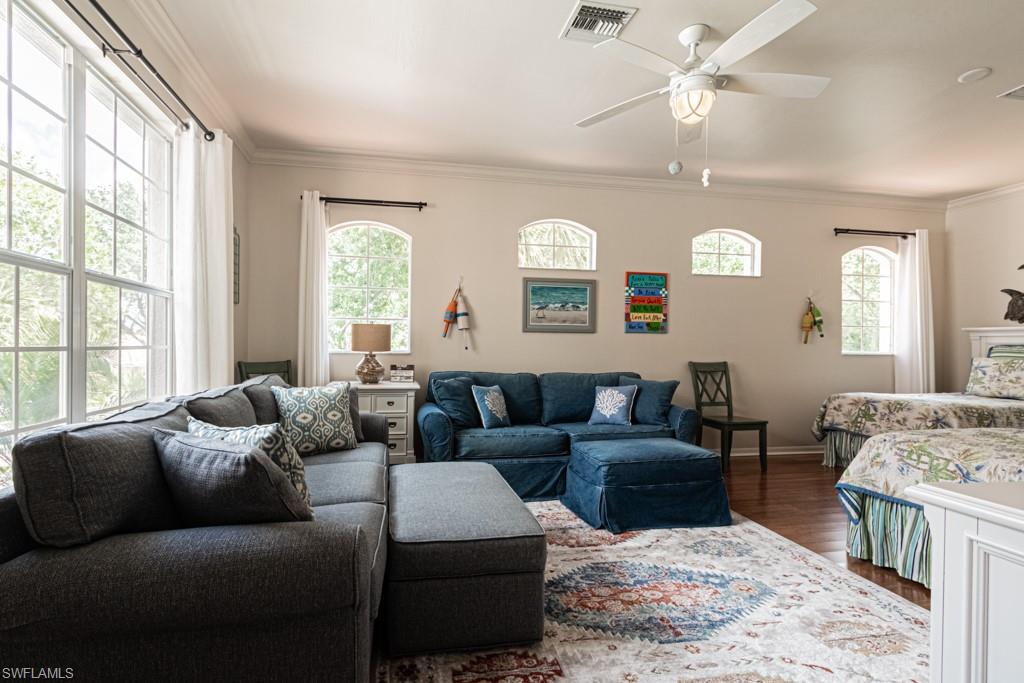 1965 Crestview Way, Unit 156 Naples, FL 34119 - Photo 23 of 45 a living room with furniture and a large window