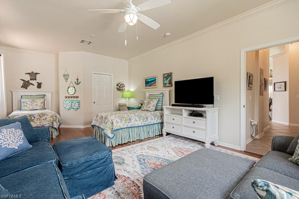 1965 Crestview Way, Unit 156 Naples, FL 34119 - Photo 24 of 45 a living room with furniture and a flat screen tv