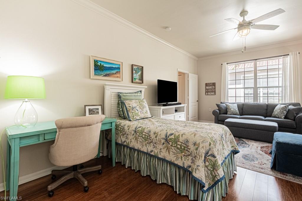 1965 Crestview Way, Unit 156 Naples, FL 34119 - Photo 25 of 45 a bedroom with a bed and a flat screen tv