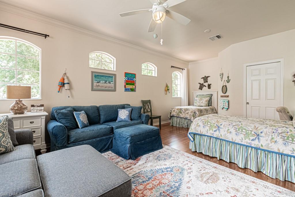 1965 Crestview Way, Unit 156 Naples, FL 34119 - Photo 26 of 45 a bedroom with furniture and windows