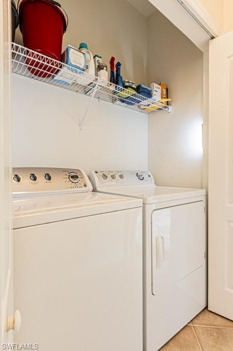 1965 Crestview Way, Unit 156 Naples, FL 34119 - Photo 27 of 45 a utility room with dryer and washer