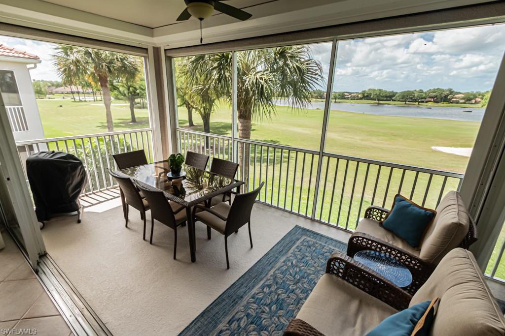 1965 Crestview Way, Unit 156 Naples, FL 34119 - Photo 31 of 45 a dining room with furniture and a floor to ceiling window