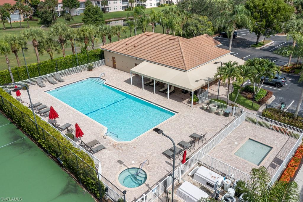 1965 Crestview Way, Unit 156 Naples, FL 34119 - Photo 42 of 45 a aerial view of a house with outdoor space and lake view
